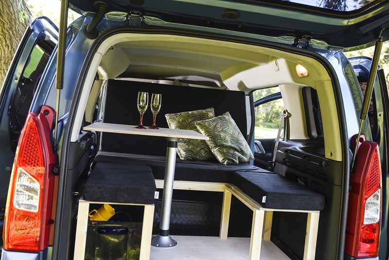 The pop-up table swivels for easy access into the camper van seating area.